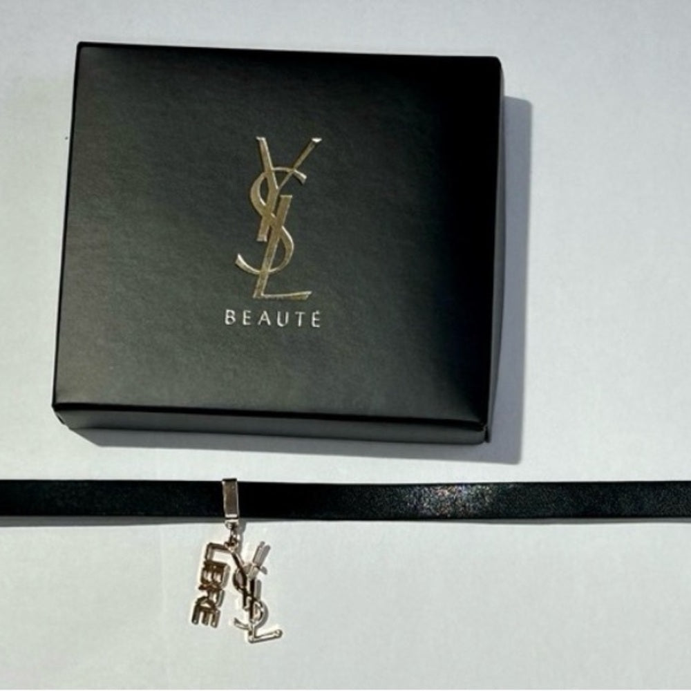 Yves Saint Laurent Black and Gold Women's Bracelet
