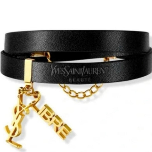 Yves Saint Laurent Black and Gold Women's Bracelet